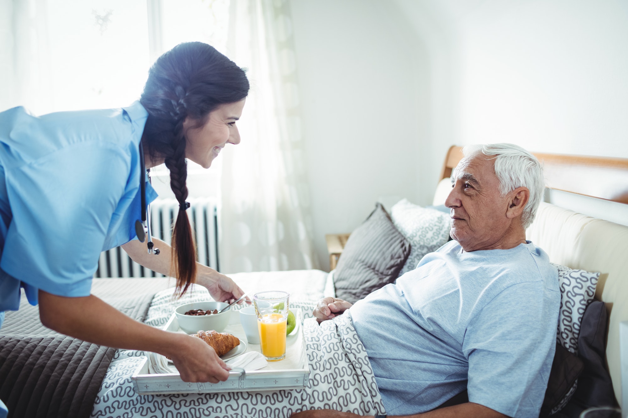 nurse-serving-breakfast-to-senior-man.jpg nurse-serving-breakfast-to-senior-man.jpg
